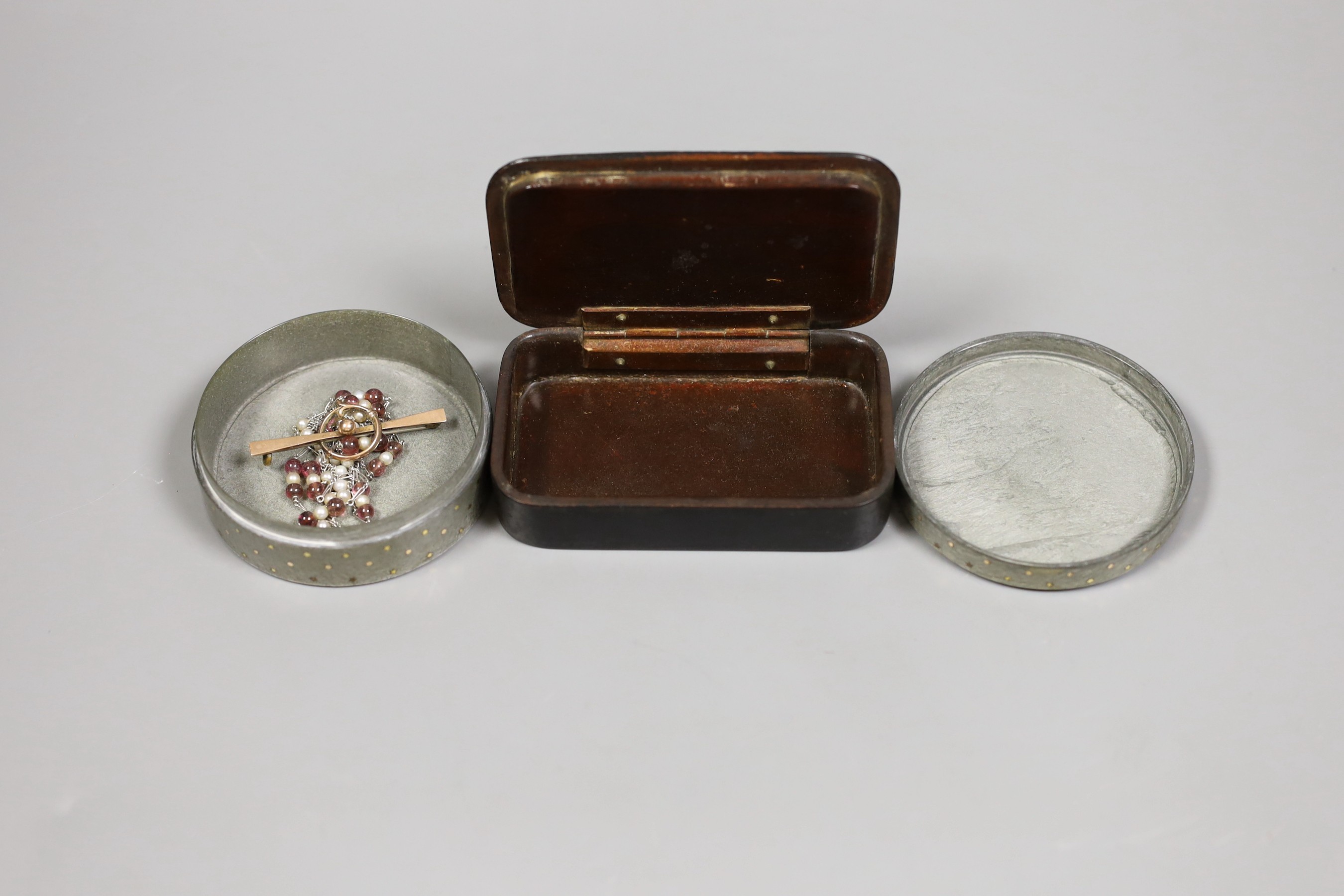A 19th century painted papier mache snuff box depicting a lady, a yellow metal piquet box and a 9ct marked yellow metal brooch